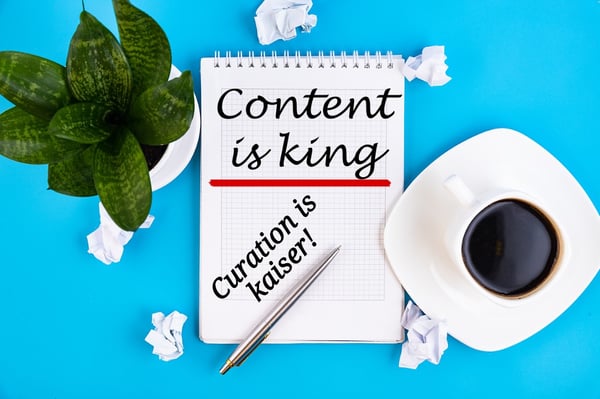 content-is-king-handwriting-on-a-notebook-with-pen-and-a-cup-of-picture-id1221777478